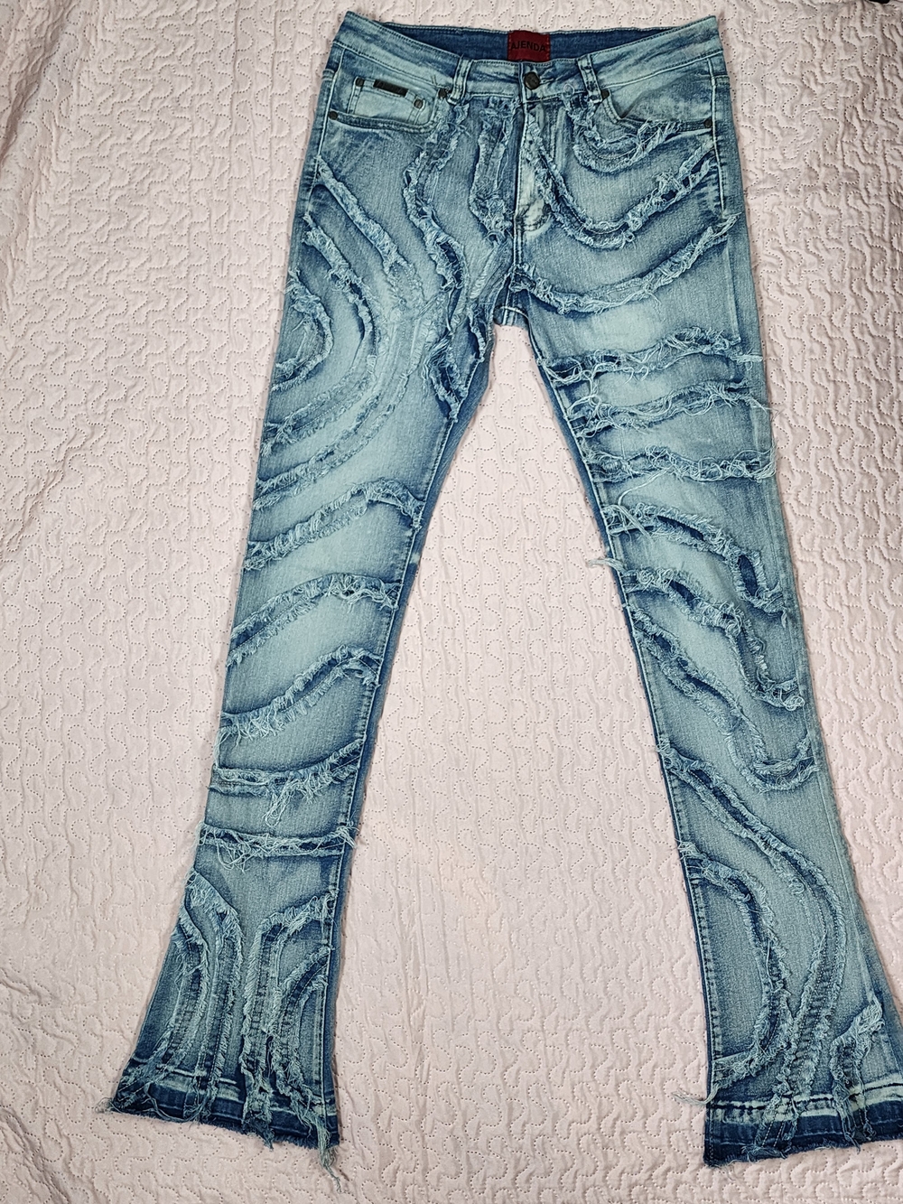 Light Blue Distressed Flare Jeans with Frayed Wave Accents